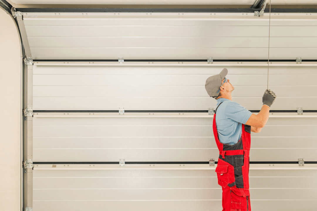 garage technician adjusting track Westchester County