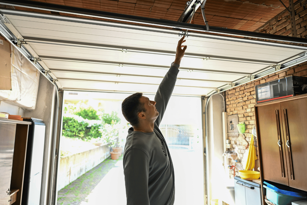 garage door stuck uneven due to broken cable
